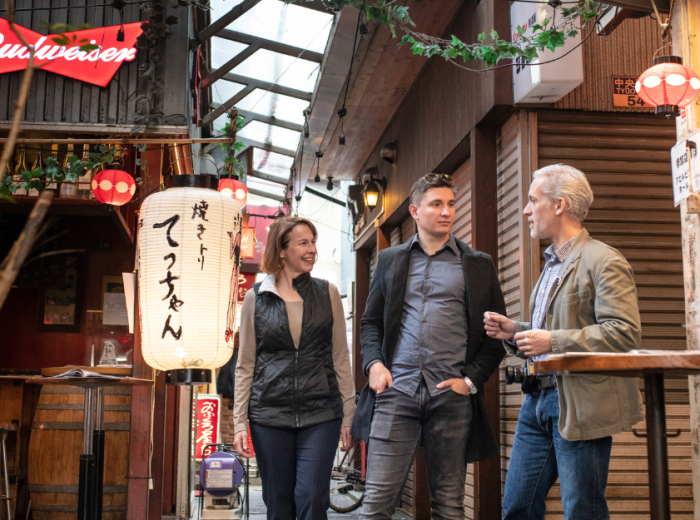 Travelers on a tour with a local guide