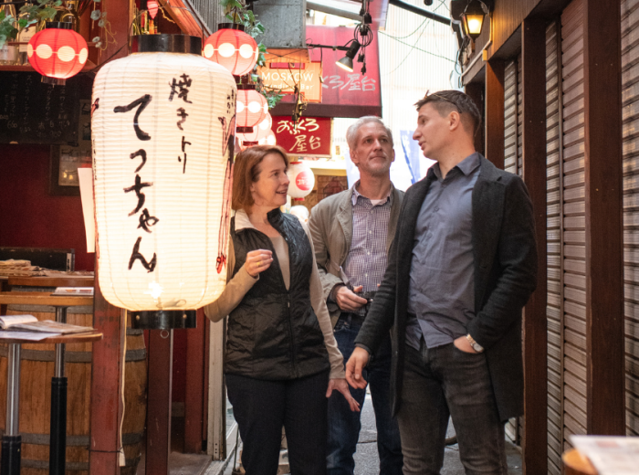 Private guide and tourists embarking on a walking tour,