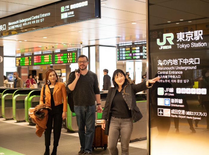 Host helping visitors find their way.