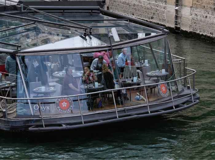 Witness the magic from the deck of a Seine River cruise