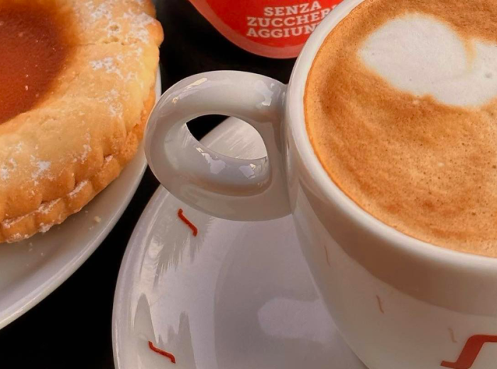 Accompanying this pretty pastry, is a drink 