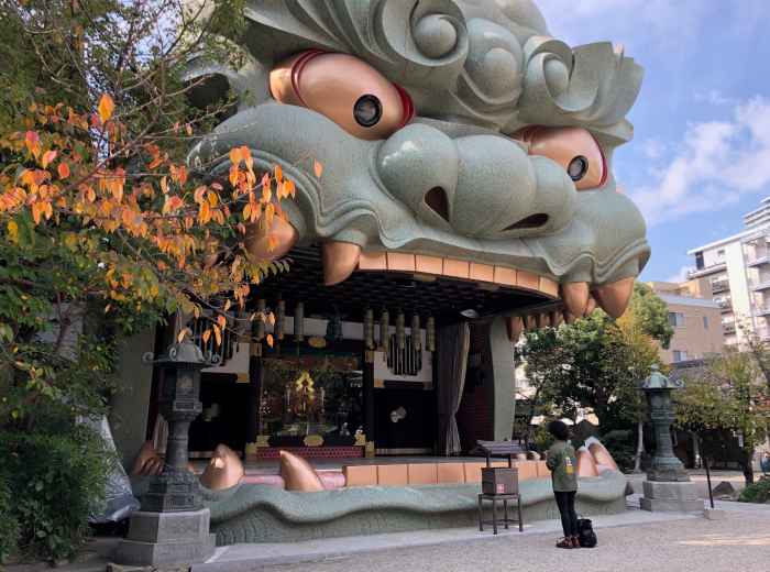 Close-up of Namba Yasaka Shrine's lion head gate 