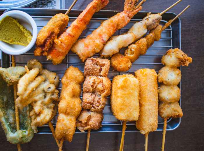 Table filled with skewered fried kushikatsu photo by Frozen Bayberry Shutterstock