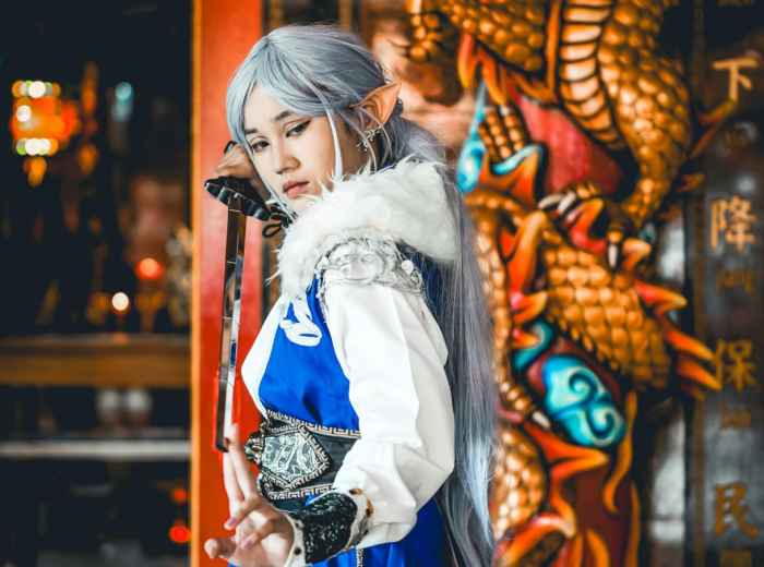 Traditional temple behind someone posing in cosplay. Image by murod podolsky from pexels.