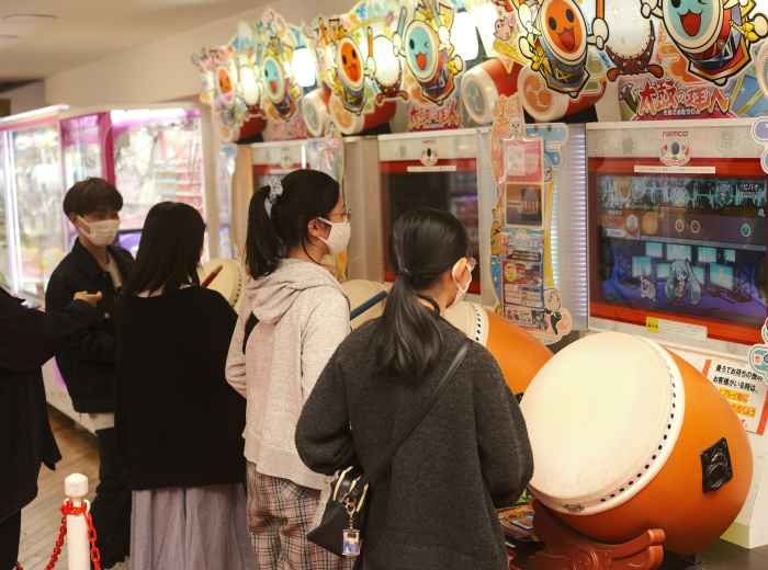 Young Osaka locals gathering near Namba arcade. Image by Perry Merrity II from Unsplash