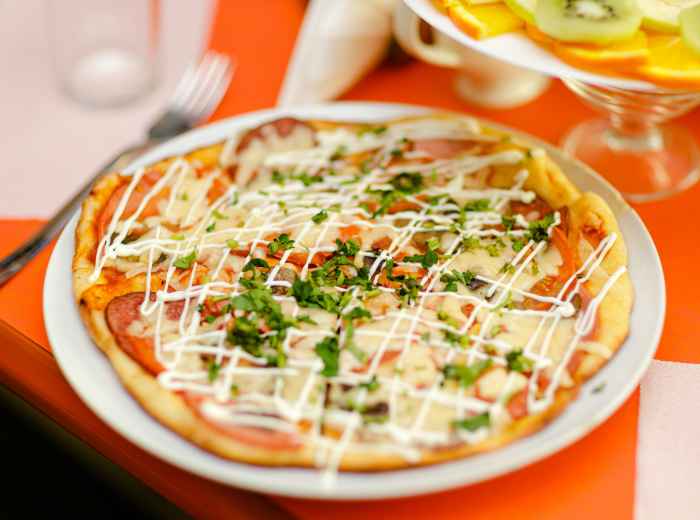 Fusion pizza with Japanese toppings. Image by Игорь Антипов from Unsplash