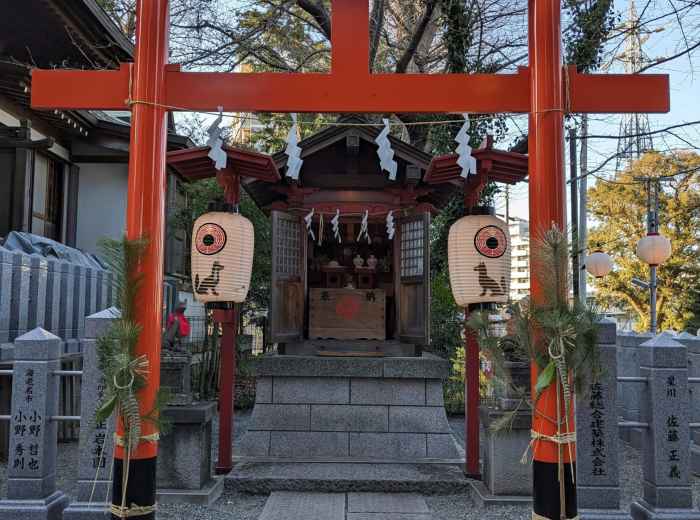 A quiet residential street in Sumiyoshi with a traditional temple gate in the background, children playing in a nearby park, and a local festival banner fluttering gently in the breeze. Photo by Tosh Kanaxx on Unsplash