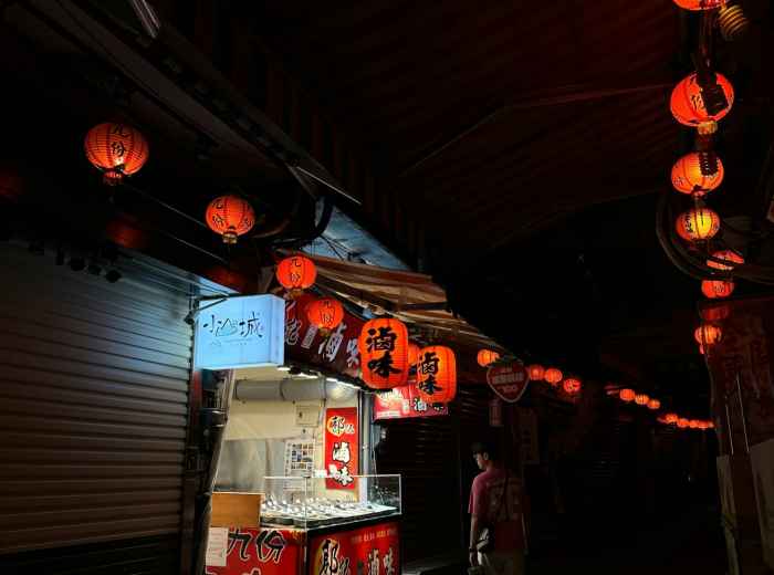 Lanterns glowing over food signage in evening atmosphere. Image by  Kang Jie from Unsplash