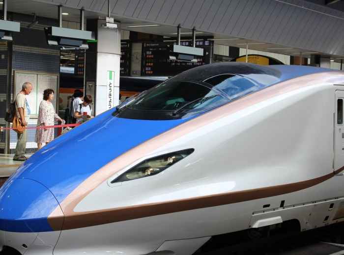 Sleek white and blue Shinkansen arriving at Shin-Osaka Station  Image by motihada from Pixabay 