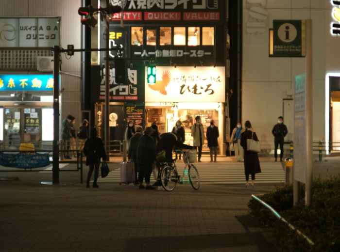 A candid moment outside a boutique hotel in Namba. Image by Mak from Unsplash