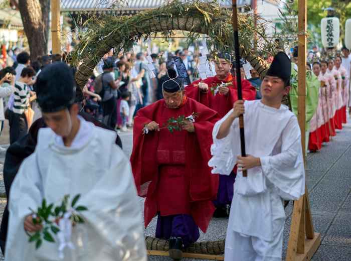 Local festival at Osaka shrine with community participation Photo by Buddy Photo on Unsplash