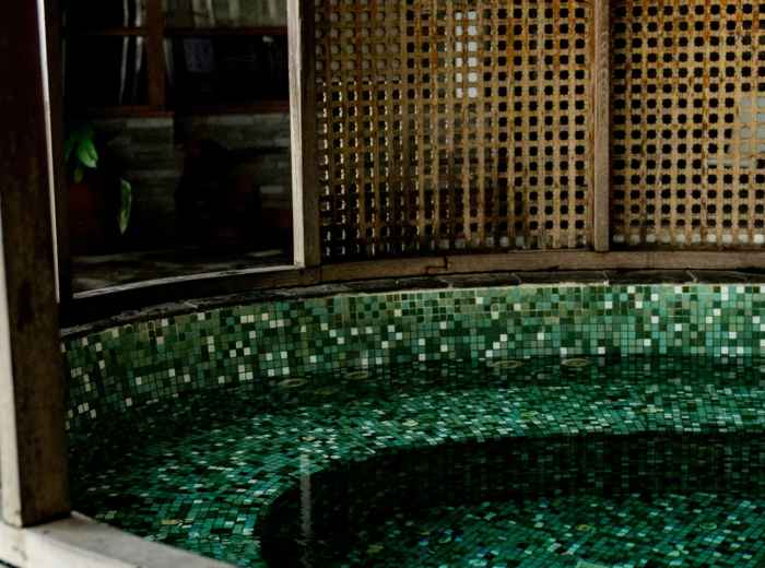  European-themed spa area with classical architectural elements and mineral pools. Photo by Frederick Shaw on Unsplash