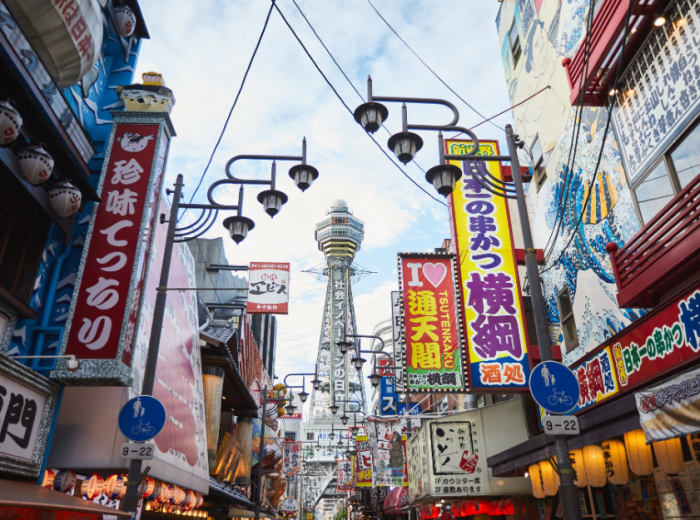 Street scene in Shinsekai district with vintage signs and kushikatsu restaurants