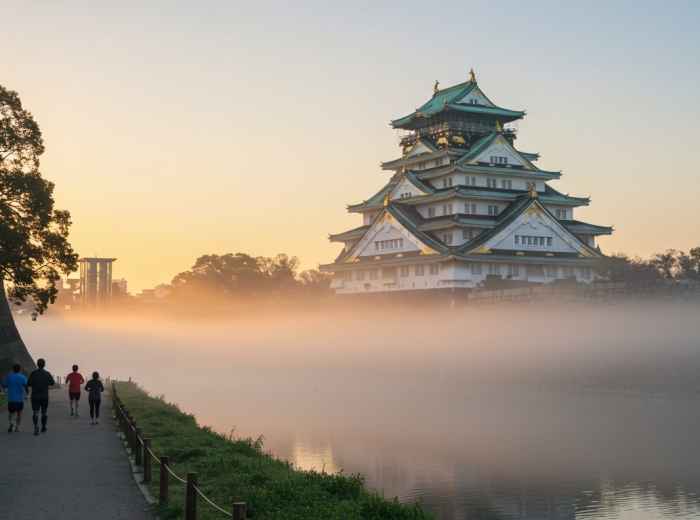  Early morning mist around Osaka Castle with joggers on the path