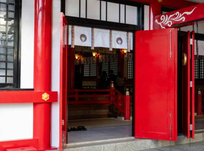 Traditional restaurant entrance requiring advance reservations for authentic dining Photo by Kouji Tsuru on Unsplash