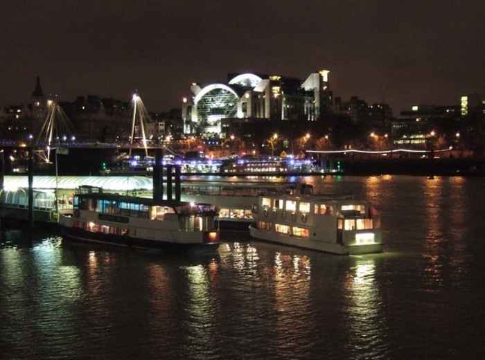 Festival boats illuminated at night on river. photo by Derek Harper on Creative Commons Attribution-Share Alike 2.0