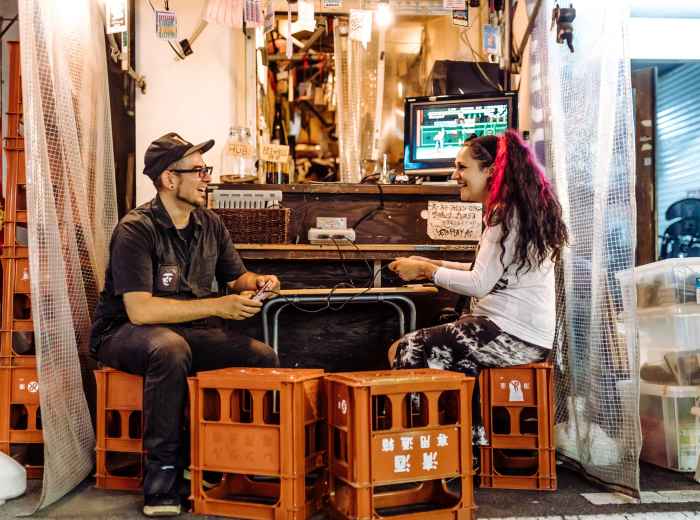 A guide sharing a personal story with guests in a relaxed, cozy setting.