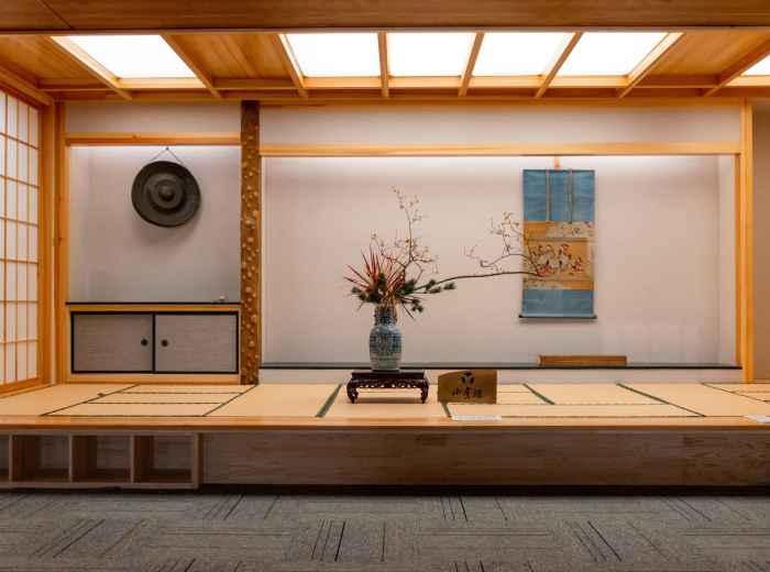 Museum interior featuring clean lines and natural materials inspired by Zen aesthetics in a modern setting.  Image by Curtain Inin on Unsplash.