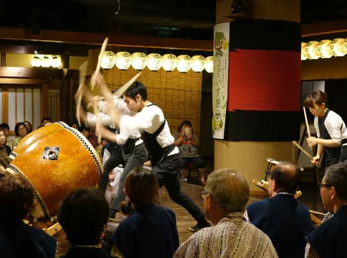 Traditional performing arts taking place in a contemporary Kyoto venue with audience engagement Photo by Arthur Tseng on Unsplash