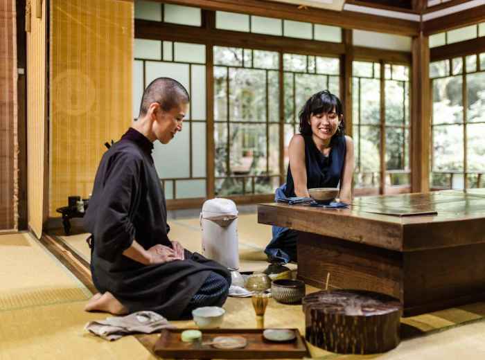 Travelers enjoying a traditional tea ceremony