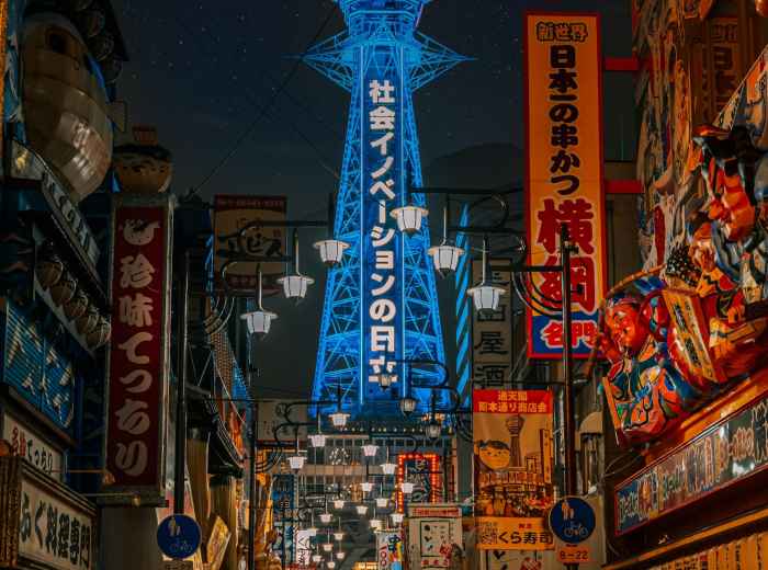 Tsutenkaku Tower lit up at dusk
