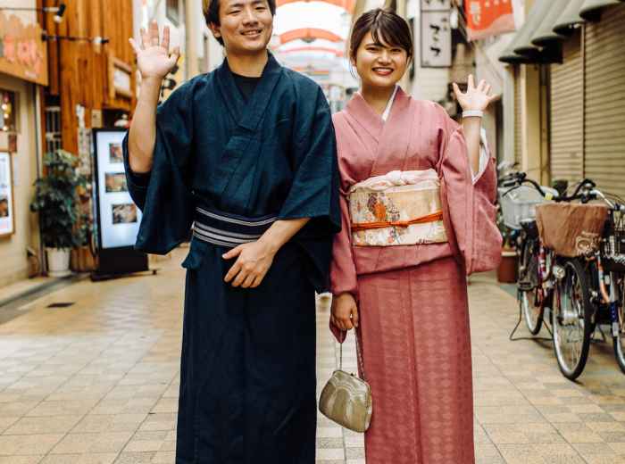 Smiling traveler at covered shopping arcade.