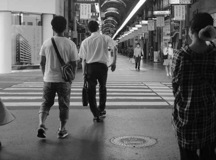 Locals walking near umeda subway station. Photo by Mak on Unsplash