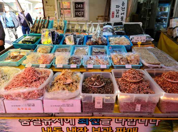 Fresh seafood display at a local market with various fish and shellfish. Photo by KG Baek on Unsplash