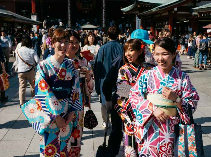 Multi-generational group enjoying time together in a typical Osaka setting. Photo by Max Anderson on Unsplash