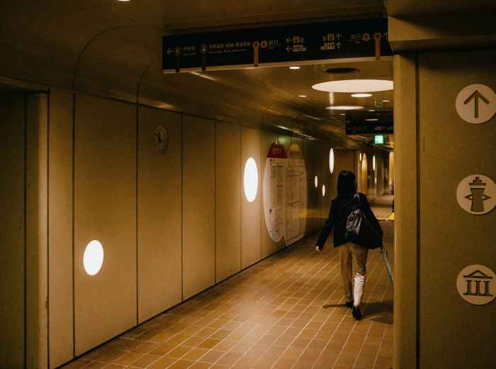 Guest confidently navigating Osaka Station independently. Photo by Nguyen Minh on Unsplash