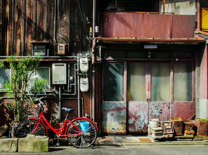 Rei's bicycle leaned on an alley wall in Nakazakicho Photo by Galih Setyo Putro on Unsplash