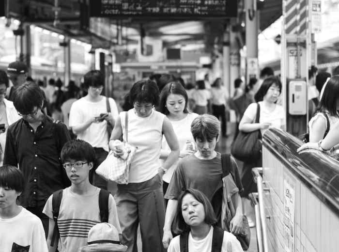 Rush hour commuters at Osaka Station. Photo by Alvaro Matzumura on Unsplash