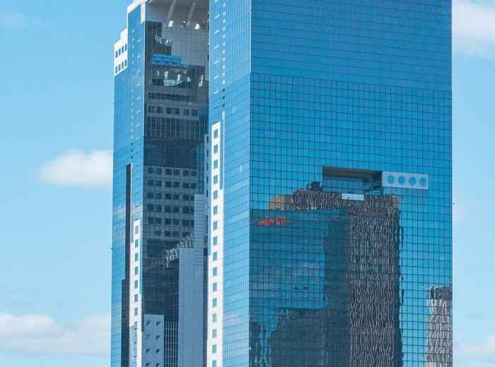 Umeda Sky Building’s distinctive architecture against sunset sky Image by 