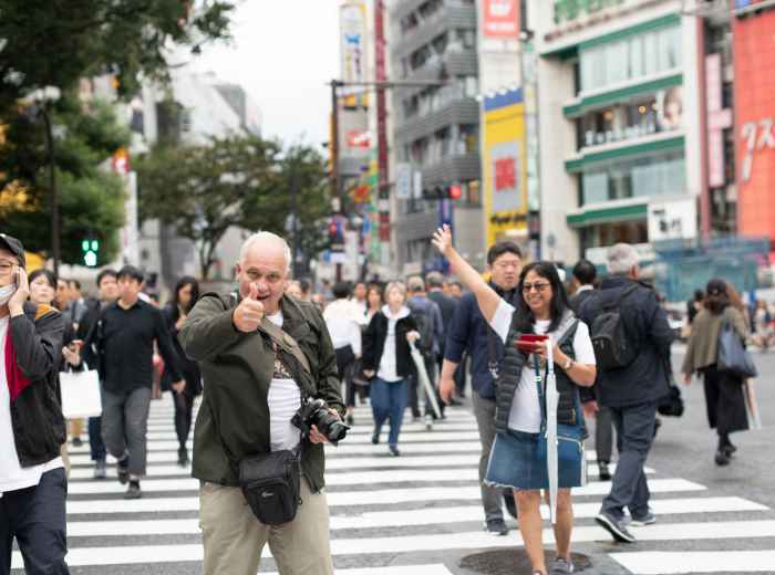 Guest posing for a photo for the host.