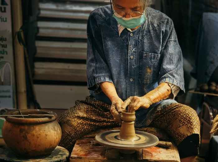 Traditional craftsman working in a small workshop Photo by Yash Parashar on Unsplash
