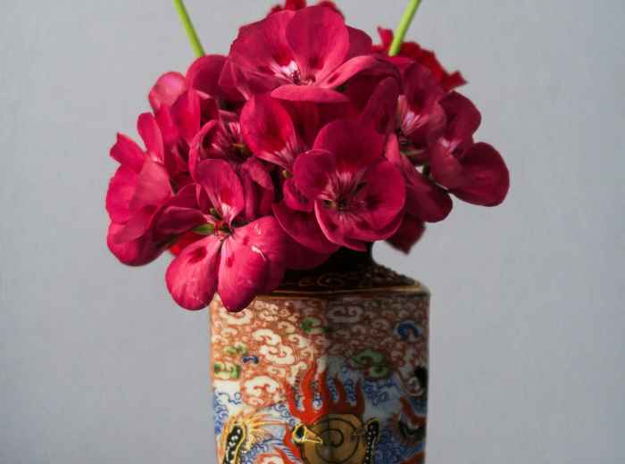 Seasonal flowers arranged in a traditional Japanese vase. Photo by Ion Apostol on Unsplash