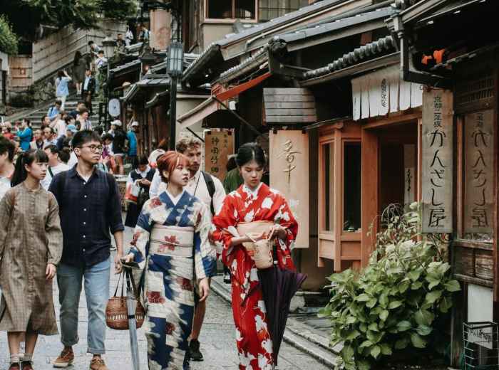 Traditional Kyoto street scene with visitors and locals walking together peacefully Photo by Kae Ng on Unsplash