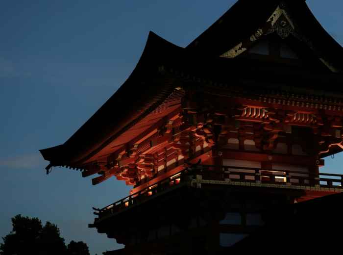 Golden hour light filtering through temple grounds Photo by Weichao Deng on Unsplash