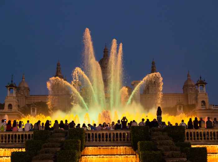 Night fountain show with colored lights