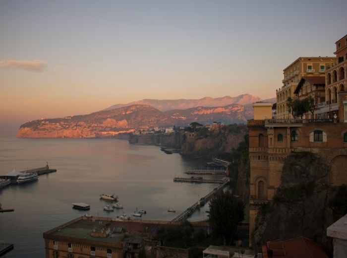Small harbor with fishing boats and stone quays