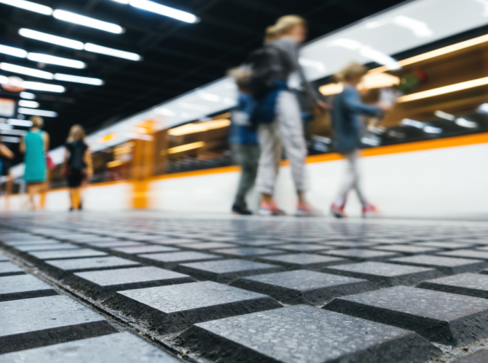 People arriving and leaving the Barcelona metro station
