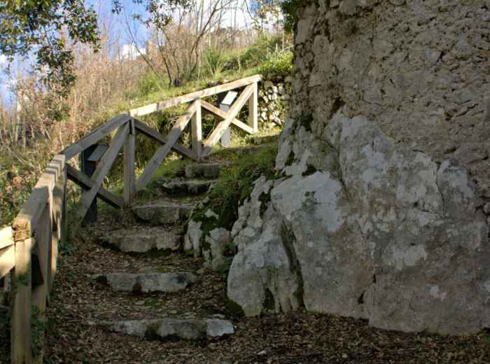 Stone steps at an ancient site with handrails