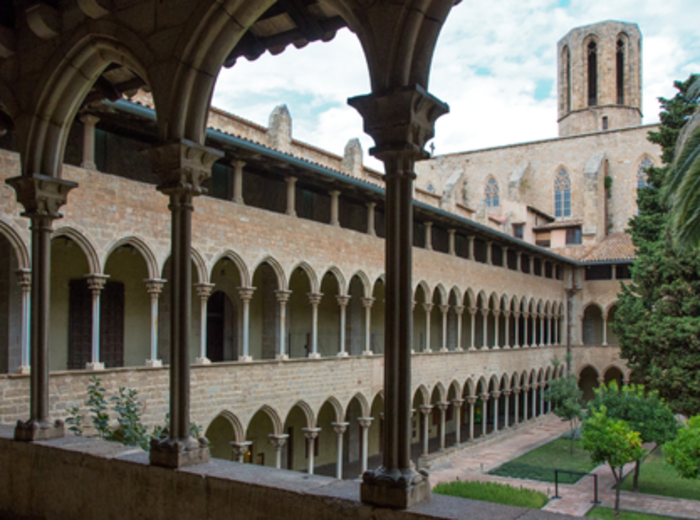 Empty Gothic cloister bathed in the soft morning light