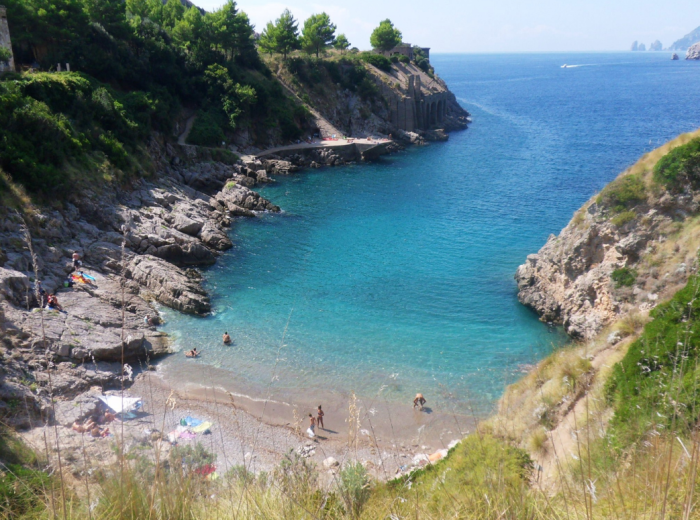 Trail to Baia di Ieranto with crystal clear waters below