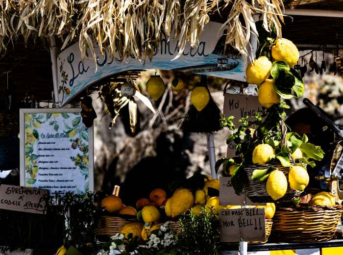 Italian market stall piled with lemons and citrus
