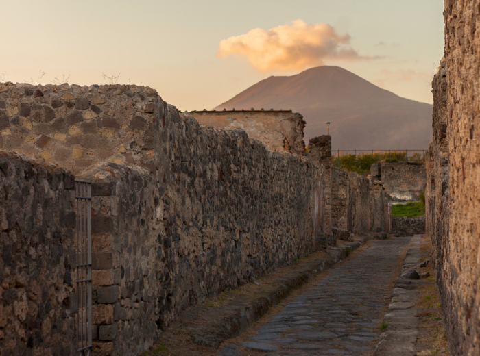 Empty Pompeii street with Mount Vesuvius in soft winter light