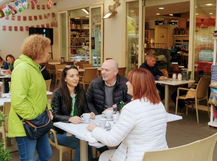 Locals chatting in a Sorrento café on a winter morning