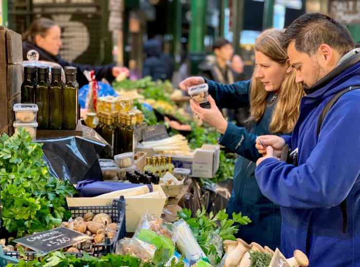 Borough Market stalls with shoppers on a weekday morning