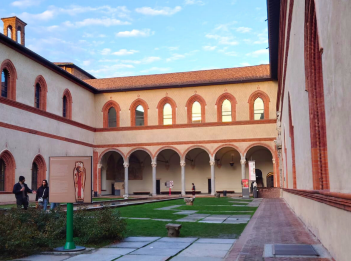 Castello Sforzesco courtyard with historic walls and sunlight