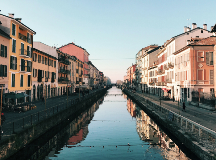 Still morning canal in Navigli with soft light on old buildings